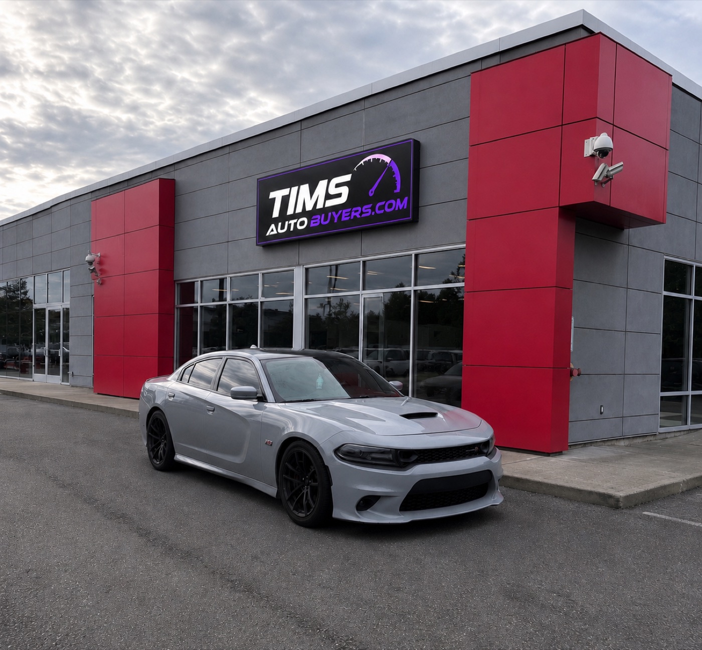 Tim's Charger Scat Pack in front of the Tims Auto Buyers store